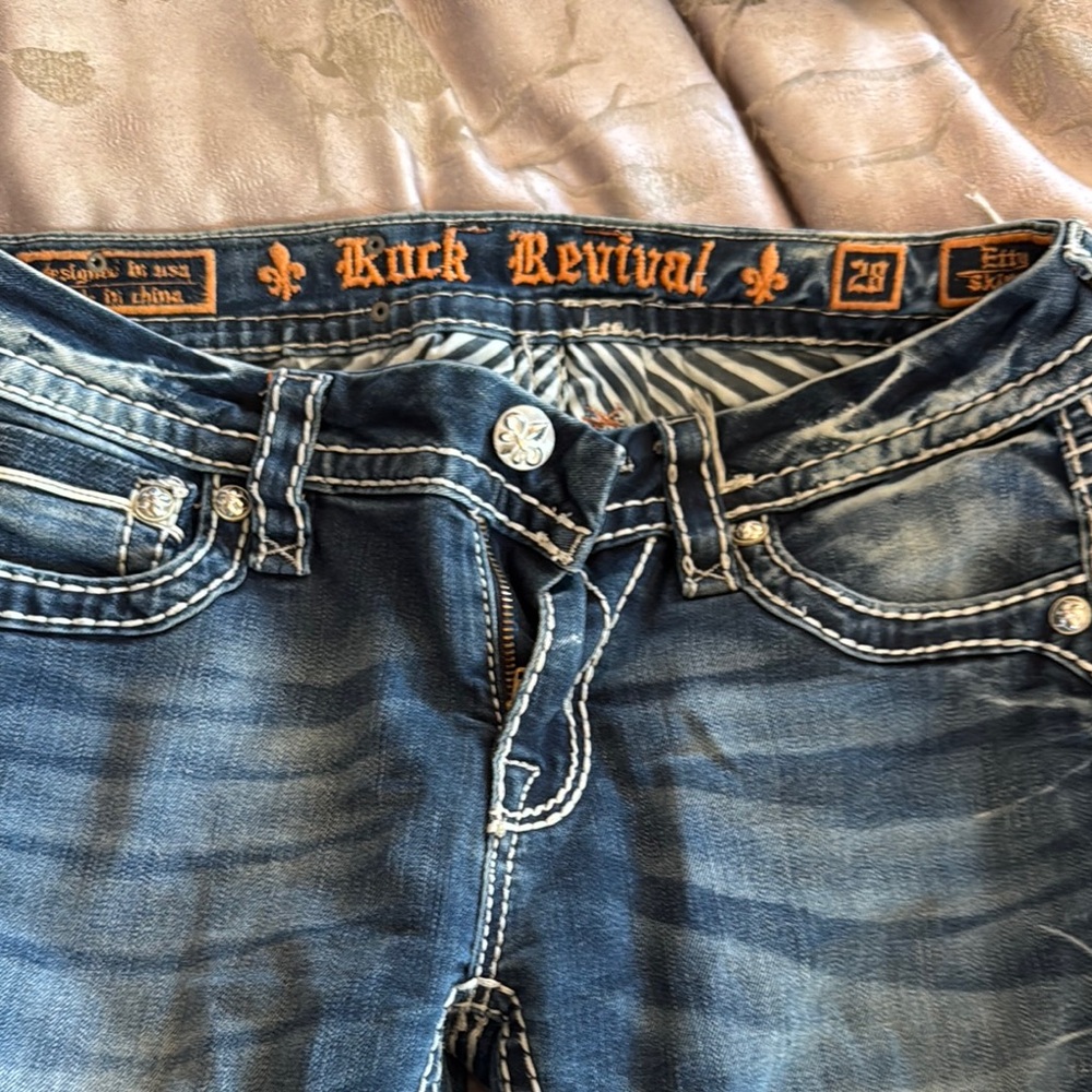 Rock Revival Blue Jeans with Decorative Stitching and Premium Design